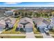 Expansive aerial view of a single-Gathering home in a residential area featuring a well-manicured lawn and mature landscaping at 3214 Bayou Bay Dr, Lakeland, FL 33811