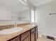 Bright bathroom featuring a double sink vanity, and tiled floors at 3214 Bayou Bay Dr, Lakeland, FL 33811