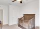 Bright Bedroom showcasing a crib and neutral carpet at 3214 Bayou Bay Dr, Lakeland, FL 33811