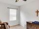 Relaxing bedroom with a window, ceiling fan, and wood dresser at 3214 Bayou Bay Dr, Lakeland, FL 33811