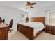 Comfortable bedroom features carpet and a ceiling fan at 3214 Bayou Bay Dr, Lakeland, FL 33811