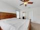 Spacious bedroom with carpet, ceiling fan and easy bathroom access at 3214 Bayou Bay Dr, Lakeland, FL 33811