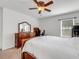 Large primary bedroom with neutral carpet, ceiling fan, and plenty of natural light at 3214 Bayou Bay Dr, Lakeland, FL 33811