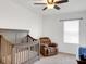 Cozy Bedroom featuring a crib, a comfortable recliner, and a window at 3214 Bayou Bay Dr, Lakeland, FL 33811