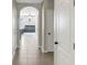 Inviting hallway features archway to living room and neutral tile flooring throughout at 3214 Bayou Bay Dr, Lakeland, FL 33811