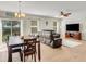 Open-concept living room and dining area, featuring modern flooring, natural light, and comfortable seating at 3214 Bayou Bay Dr, Lakeland, FL 33811