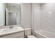 Clean bathroom featuring a white vanity, framed mirror, tile backsplash, and a shower/tub combo at 5421 Sw 82Nd Ter, Ocala, FL 34481