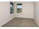 Bright bedroom featuring neutral carpet, light gray walls and a bright window at 5421 Sw 82Nd Ter, Ocala, FL 34481