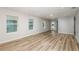 Well-lit living room with wood-look flooring, recessed lighting, and neutral paint at 5421 Sw 82Nd Ter, Ocala, FL 34481