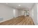 Open-concept living room with wood-look flooring flowing to the kitchen, with modern finishes at 5421 Sw 82Nd Ter, Ocala, FL 34481