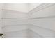 Walk-in pantry featuring multiple tiers of wire shelving providing ample storage at 9009 Sw 52Nd Place Rd, Ocala, FL 34481