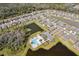 Aerial view of homes near community pool and greenery at 4323 Trotters Way, Lakeland, FL 33801