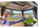 Relax in a beautiful backyard gazebo offering serene lake views, perfect for outdoor enjoyment at 4323 Trotters Way, Lakeland, FL 33801