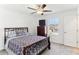 Cozy bedroom featuring a decorative bed frame, dresser, and plenty of natural light at 4323 Trotters Way, Lakeland, FL 33801