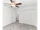 Cozy bedroom features a ceiling fan, closet, and neutral carpet, providing a comfortable retreat at 4323 Trotters Way, Lakeland, FL 33801