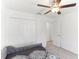 Bright bedroom with a ceiling fan, closet, and neutral carpet create a serene and inviting space at 4323 Trotters Way, Lakeland, FL 33801