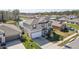 Two-story home with well-kept lawn, attached garage, and view of pond at 4323 Trotters Way, Lakeland, FL 33801