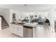 Open kitchen with granite countertops, stainless steel appliances, and views to the living area at 4323 Trotters Way, Lakeland, FL 33801