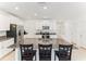 Spacious kitchen with large island, granite countertops, stainless appliances, and a breakfast bar at 4323 Trotters Way, Lakeland, FL 33801