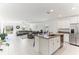 Bright, open-concept kitchen with granite countertops, stainless steel appliances, and a view of the living area at 4323 Trotters Way, Lakeland, FL 33801