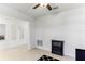 Stylish living room features a ceiling fan and an electric fireplace at 4323 Trotters Way, Lakeland, FL 33801