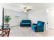 Bright living room featuring plush seating, a ceiling fan, and a view from the window at 4323 Trotters Way, Lakeland, FL 33801