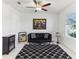 Stylish living room features a ceiling fan and a modern black and white rug at 4323 Trotters Way, Lakeland, FL 33801