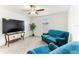 Cozy living room features a ceiling fan and natural light from the window at 4323 Trotters Way, Lakeland, FL 33801