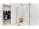 Bright main bathroom with a walk-in shower, wooden stool, and open doorway to closet at 4323 Trotters Way, Lakeland, FL 33801