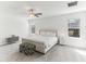 Spacious main bedroom with carpet, ceiling fan, and a large bed with decorative pillows at 4323 Trotters Way, Lakeland, FL 33801