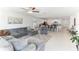 A spacious open concept living area seamlessly blends the kitchen, dining, and living spaces at 4323 Trotters Way, Lakeland, FL 33801