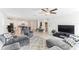 A spacious living room blends seamlessly into the open concept kitchen, perfect for entertaining at 4323 Trotters Way, Lakeland, FL 33801