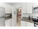 Well-organized pantry with ample shelving and storage adjacent to the kitchen at 4323 Trotters Way, Lakeland, FL 33801