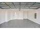 Spacious two-car garage with a finished floor and plenty of storage space at 8731 Sw 57Th Ln, Ocala, FL 34481