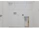 Laundry room with white walls, tile floor, and wire shelving at 8731 Sw 57Th Ln, Ocala, FL 34481