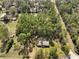 Aerial view of a home surrounded by tall trees offering lots of shade and privacy at 10774 Sw 185Th Ter, Dunnellon, FL 34432