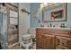 Charming bathroom with tiled shower, wood vanity, and stylish fixtures at 10774 Sw 185Th Ter, Dunnellon, FL 34432