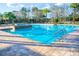 Community pool featuring a spacious deck area, providing a relaxing outdoor environment for residents to enjoy at 469 Liu Ln, Deland, FL 32724