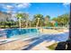 Community pool with palm tree water features creating a tropical, Gathering-friendly atmosphere for relaxation at 469 Liu Ln, Deland, FL 32724