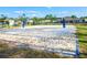 Community sand volleyball court, providing a recreational space for residents with well maintained netting and lines at 469 Liu Ln, Deland, FL 32724