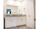 Bright bathroom featuring double sinks with granite countertop and white cabinets at 469 Liu Ln, Deland, FL 32724