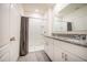 Clean bathroom featuring a walk-in shower, granite countertops, and dual sinks at 469 Liu Ln, Deland, FL 32724