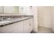 Bathroom featuring granite countertop and double sinks at 469 Liu Ln, Deland, FL 32724