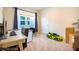 Well-lit bedroom with a work desk, bright window, and play car at 469 Liu Ln, Deland, FL 32724