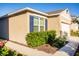 Exterior shot featuring a home with blue shutters and neatly trimmed bushes along the foundation at 469 Liu Ln, Deland, FL 32724