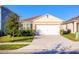 Charming single-story home featuring a two-car garage, well-maintained lawn, and neatly trimmed hedges at 469 Liu Ln, Deland, FL 32724