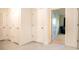 Hallway with multiple closet doors, leading to a bedroom with natural light at 469 Liu Ln, Deland, FL 32724