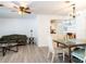 Cozy living room featuring new hardwood flooring, modern ceiling fan, and furniture at 2001 Cricket Dr, Orlando, FL 32808