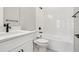 Clean bathroom with white tub, toilet, and vanity at 2308 Depauw Ave, Orlando, FL 32804