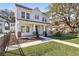 Elegant two-story home with a welcoming front porch and manicured lawn at 2308 Depauw Ave, Orlando, FL 32804